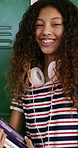 Face, student or girl with books by locker in school, learning or confident for knowledge development. Portrait, child or happy teenager with study material for education, laugh or scholarship pride