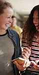 Girls, laugh or walk in high school with phone, funny social media post or bonding together at recess. Happy, teenager students or friends in hallway with books, tech or online meme for text message.