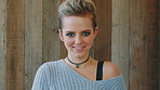 Happy, woman and face of student by wall for education, studying or learning with confidence. Smile, scholarship and portrait of female person with pride for college about us on university campus.
