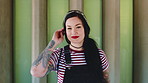 Fashion, happy and face of woman in city for trendy clothes, style and edgy aesthetic for confidence. City, smile and portrait of person with cool clothing, outfit and tattoos on wall background
