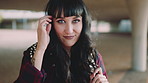 Happy girl, face and student with fringe hairstyle in city for fashion sense or style. Portrait, female person or learner with smile, gen z or backpack of brunette for flirt, attraction or shyness