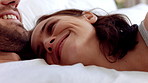Couple, love and cuddle on bed in home, relax and affection for partner and commitment for marriage. Happy people, resting and embrace with spouse in bedroom, man and bonding with woman or romance