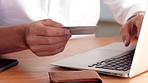 Man, hands and credit card with laptop for online shopping, payment or wireless transaction in home. Male person, shopper or banking with debit or computer for ecommerce or digital purchase in house