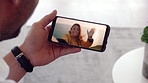 Man, hands or video call with phone screen for travel or greeting partner on holiday trip. Male person, talking or woman blowing kiss with wave or smartphone for virtual chat on sightseeing adventure