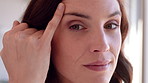 Skincare, checking and face of woman in home with wrinkles for anti aging, beauty or wellness. Smile, cosmetics and portrait of mature female person with facial dermatology for health in house.