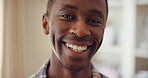 Face, man and happy to relax in home for peaceful morning, weekend break and positive attitude. Laughing, black person and smile in living room for comfortable afternoon, calm day off and wellness