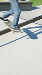 Athlete, legs and jump with skateboard in city, ride and practice for skill development and fitness. Outdoor, skater and person with trick for extreme sport, performance and training for competition