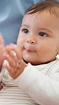 Closeup, clapping and parents with baby in home for development, motor skills and bonding. Family, happy and child excited for learning, stimulation and expression with applause for growth in house