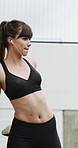 Runner, earphones and stretching with woman in city for streaming service, health podcast and cardio. Wellness, exercise playlist and training music with person outdoor for audio, warm up and radio