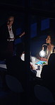 Woman, presentation and team in night at office meeting with planning, discussion or review with tech. Person, group and pitch with insight, solution and collaboration with feedback at finance agency