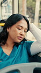 Tired, commute or nurse on bus with sleep, exhausted or burnt out in town travel. Fatigue, doctor or Asian woman at window with low energy, overworked or passenger journey in city transportation.
