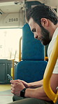Journey, phone and man in bus for online post, typing message and check notification on app. Mobile, public transport and passenger on internet for travel update, networking and morning commute