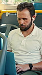 Businessman, commute and laptop on bus with earphones, streaming music and typing report for work. Worker, person and audio tech on public transport with journey, radio and computer to check email.