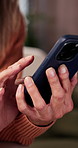 Phone, hands and woman on sofa in home with texting, communication or chatting on mobile app. Typing, technology and person with cellphone for online blog, social media or connectivity in house.