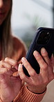 Typing, hands and woman with phone on sofa in home with texting, communication or chatting on app. Research, technology and person with cellphone for blog, social media or connectivity in house.