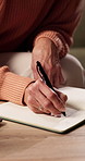 Writing, home and hands of mature woman with book for to do list, reminder and schedule for planning. House, notebook and person with checklist to remember daily tasks, agenda and goals in diary