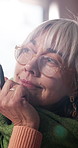 Creative, thinking and mature woman in house, remember and planning for story development in lounge. Author, reflection and person with ideas for novel, contemplating and happy with genre decision