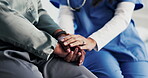 Healthcare, support and nurse with old person, holding hands and consultation in hospital or empathy. Clinic, medical professional and explaining diagnosis to elderly patient, comfort and senior care