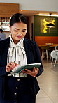 Walking, lobby and woman on tablet in hotel for booking schedule, planning and online reservation. Hospitality, manager and person on digital tech for check in, website and accommodation at resort