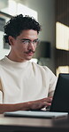 Creative, man and typing on laptop in office for research, editing draft and fact checking. Editor, person and tech at agency for article feedback, proofreading or grammar review of story publication