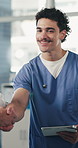 Doctor, man and tablet at handshake in hospital with smile for success, goals and motivation with team. People, tech and celebration with support, applause or app for healthcare services at clinic