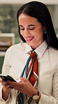 Businesswoman, smile and typing in office with phone, check company notification and email response. Happy, person and browsing in workplace with tech, social media update and text message for job.