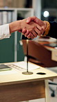 Business, night or people in office with handshake, greeting or negotiation in b2b deal. Networking, introduction or employees with shaking hands, agreement or partnership opportunity in evening.