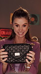 Fashion, influencer and woman in home with video, unboxing bag or excited discussion for PR package. Happy, person or content creator talk with social media live stream, vlog or wow for purse reveal.