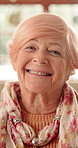 Retirement, happy and face of elderly woman with smile for wellness, thinking and positive memory. Nursing home, relax and portrait of senior person with pride for good mood, calm or peace on weekend