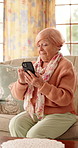 Shock, phone and senior woman on sofa for communication, social network and online gossip. Retirement, surprise and elderly person on cellphone for reaction to news, message and announcement in home