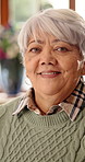 Happy, relax and face of senior woman on sofa in home with peaceful, calm and break on weekend. Smile, positive attitude and portrait of elderly female person with pride for retirement in living room