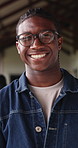 Happy, education and face of black man at university with confidence for study scholarship. Smile, knowledge and portrait of African male student with pride for future or college goals on campus.