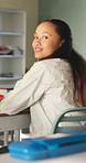 Happy, classroom and face of woman at university with confidence for education in lecture. Smile, study and portrait of female student with pride for studying, knowledge or lesson at college campus.