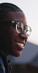 Thinking, education and black man outdoor at university with ideas, planning or decision for scholarship. Happy, glasses and African student with choice for college, study goals or future on campus.