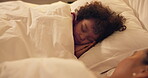 Sleeping, child and relax with mom in bedroom, home and single parent with son at night or together. Tired, family and dreaming on comfortable mattress, woman and resting with kid on bed and nap