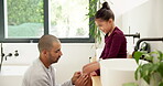 Plaster, knee and dad with child for care, love and support with injury in bathroom or home. Gentle, development and man or father with daughter helping with wound for healing, parenting and wellness