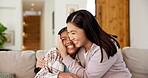 Laughing, mother and child with hug on sofa for bonding together, appreciation and connection. Security, happy woman and daughter with affection in house for healthy relationship, trust and comfort