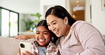 Video game, parent or child in house with phone, playing together or good time in digital contest. Laugh, mom or girl on couch with tech, family bonding or fun competition in virtual activity.

