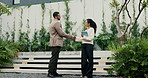 Handshake, partnership and business people outdoor with deal, welcome or negotiation for legal meeting. Greeting, discussion and environmental attorneys shaking hands for conservation agreement.