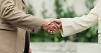 Handshake, negotiation and business people outdoor with deal, welcome or partnership for legal meeting. Greeting, discussion and environmental attorneys shaking hands for conservation agreement.