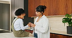 Plaster, hurt and mother with child in kitchen for accident, pain or injury with first aid in home. Bandage, family and mom helping girl kid with hand sore or wound on counter for care in house.