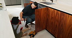 Repair, tools and dad with child in kitchen for maintenance, plumbing issue and diy by sink. Family, home and father with girl for help, learning and bonding with equipment for leak, pipes and fixing
