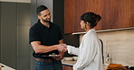 Woman, customer and handshake with plumber for home repair, consultation or service in kitchen. Female person, meeting or shaking hands with handyman for renovation, fix or maintenance in house