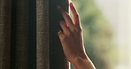 Woman, touch and hand in home with curtain, sad or regret with reflection for decision. Person, contemplation and thinking for perspective, loss or grief with mental health in morning in house