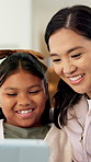 Girl, mother and laugh with tablet on sofa for games, bonding or smile with movie choice in family home. Asian people, mom and child with tech, application and happy with online contest at house