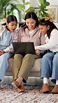 Mother, children and relax on sofa with laptop, bonding or smile with movie choice in family home. Asian people, mom and girl kids with computer, streaming service or happy with online video at house