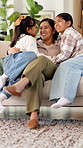 Happy, mom and children in home with hug, healthy relationship or playful bonding for child growth. Laugh, run or family on couch with embrace, childcare or parent connection in childhood development