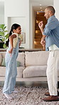 Dancing, smile and father with child in living room, support and family bonding for healthy relationship. Music, happy man and girl with learning for disco moves, fun and groove together in home