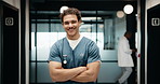 Portrait, man and nurse with arms crossed in hospital for learning, internship and medical trainee. Smile, male person or confident for education, nursing program and healthcare practice for wellness