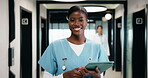 Face, nurse and happy with tablet in healthcare for clinic database, medical records and about us. Health professional, woman and smile with tech in corridor for telehealth, work schedule and trust